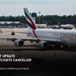 Emirates aircraft at an airport during UAE flight update on Kuwait route cancellations.