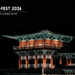 Traditional Korean building illuminated at night.