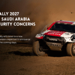 Dakar Rally truck racing through dust.