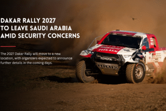 Dakar Rally truck racing through dust.
