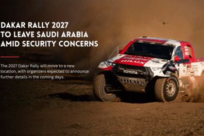 Dakar Rally truck racing through dust.