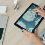 Doctors reviewing medical scans on a tablet.