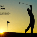 Golfer swinging at sunset on a golf course.
