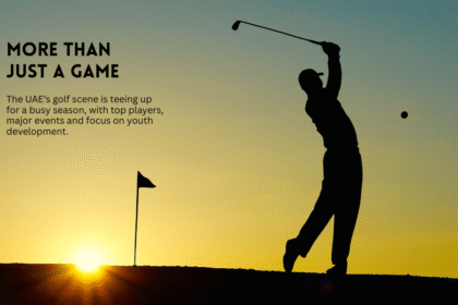 Golfer swinging at sunset on a golf course.